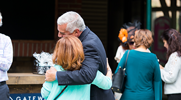 Couple hugging in front of Church in Agoura Hills