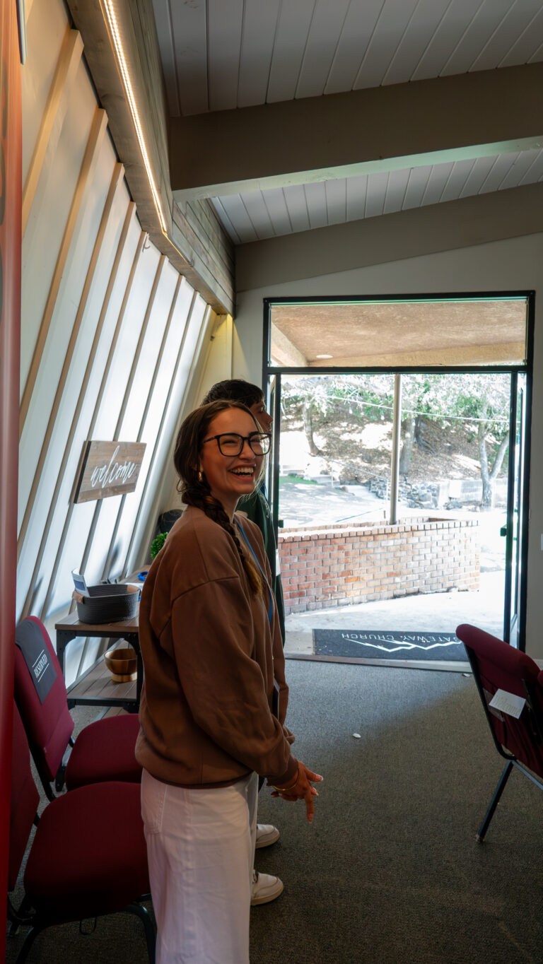 A woman smiling at church